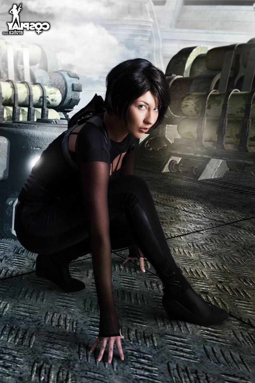 12P Dark haired cosplayer sucks on the barrel of her rifle before showing her tits