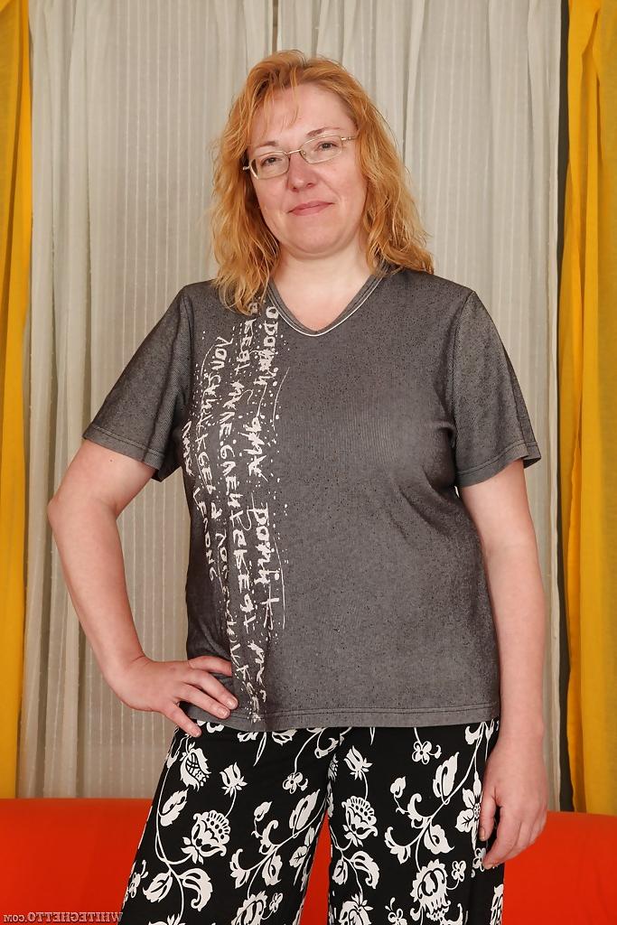 16P Chubby redhead mature gal with big flabby jugs getting naked
