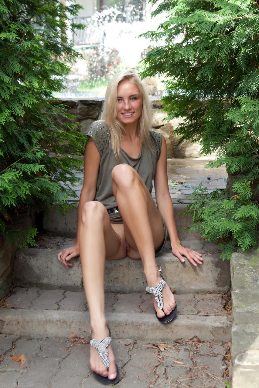 20P Alluring blonde Jaime A undressing and posing butt naked outdoors