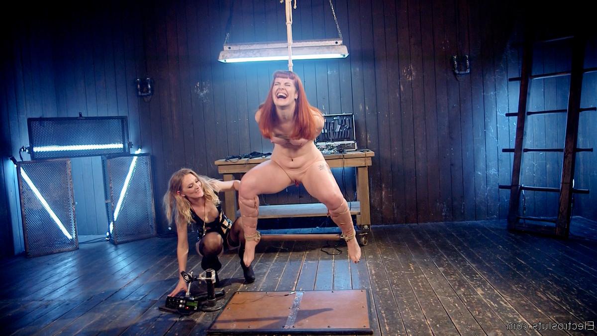 20P Redhead Barbary Rose endures electrical play & a rough toying in bondage