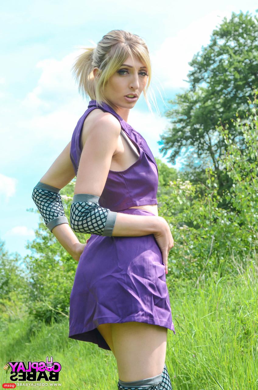 15P Gorgeous British model Jessica Jensen poses in her purple costume in nature