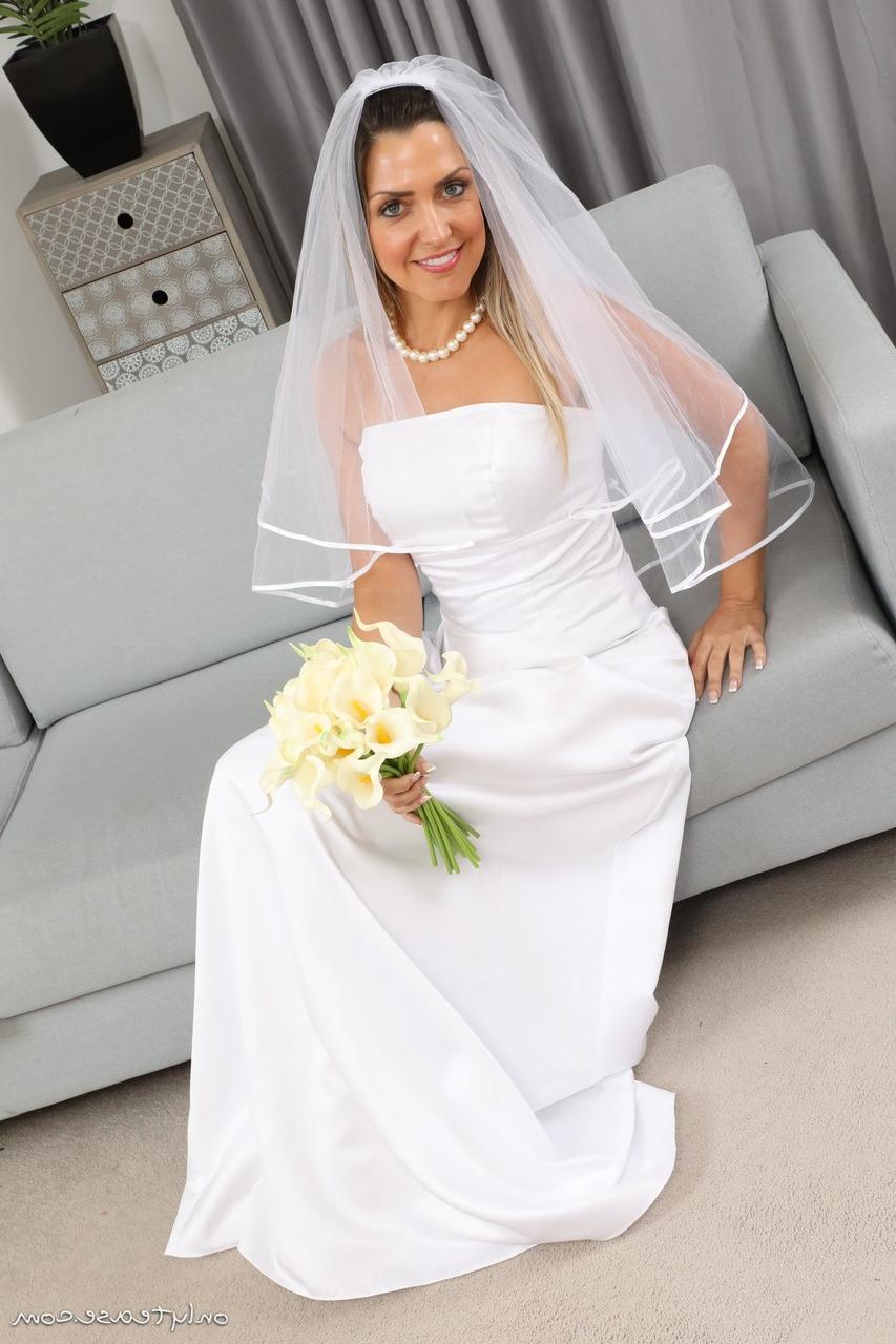 16P Miss V releases her tiny tits from her wedding dress during solo action