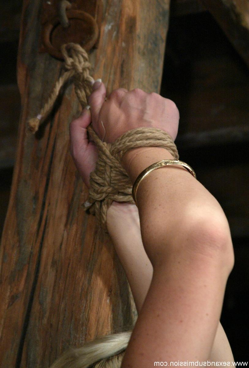 20P MILF with big boobs Bobbi Dean has her shaved pussy exposed in rope bondage