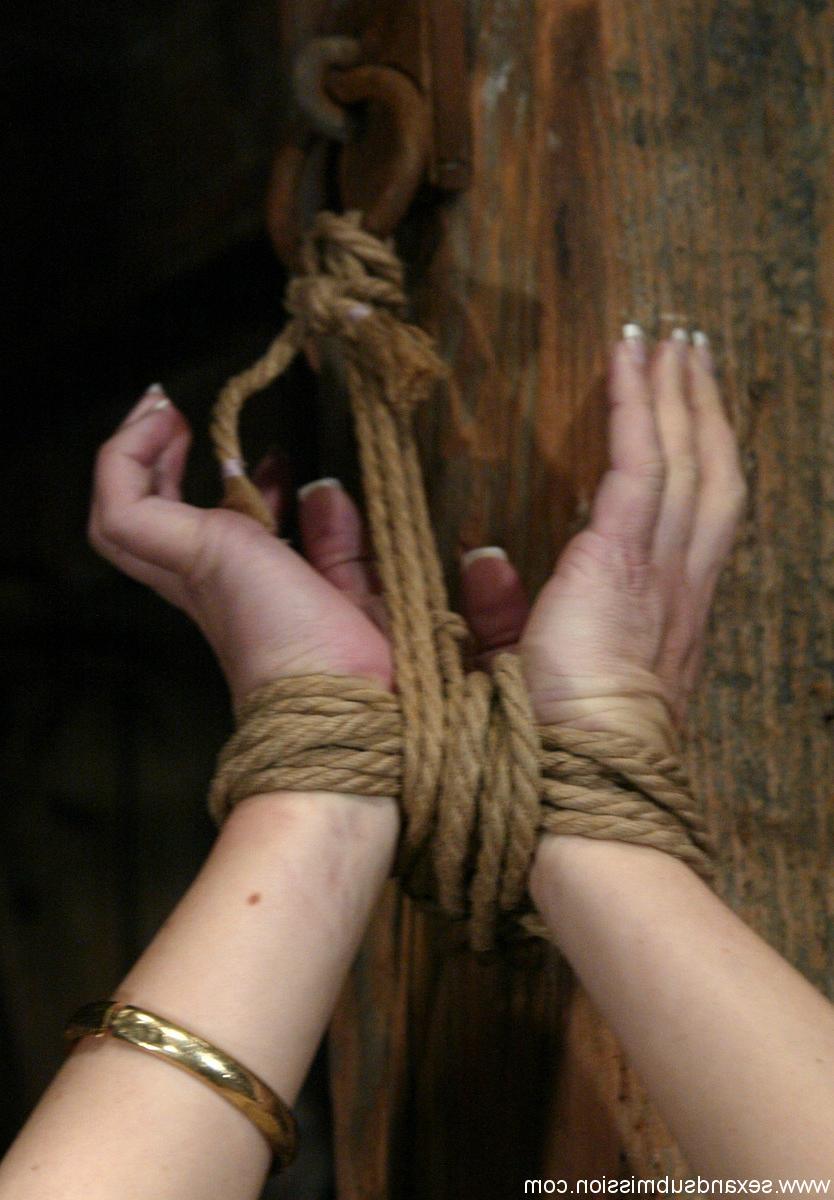 20P MILF with big boobs Bobbi Dean has her shaved pussy exposed in rope bondage