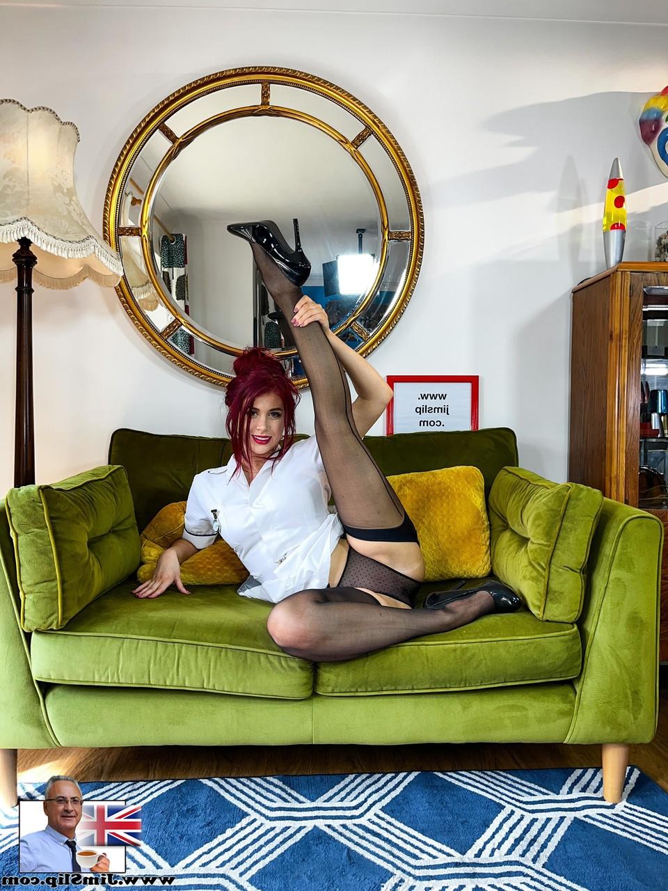 20P Redheaded European Atlanta Moreno poses in her uniform, stockings & heels