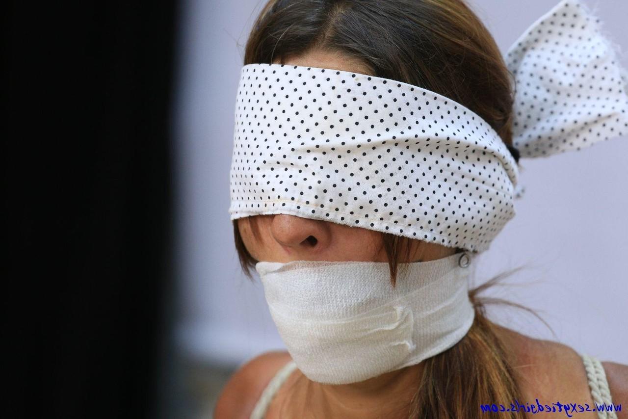 16P Caucasian girl is tied to a stool while topless and blindfolded