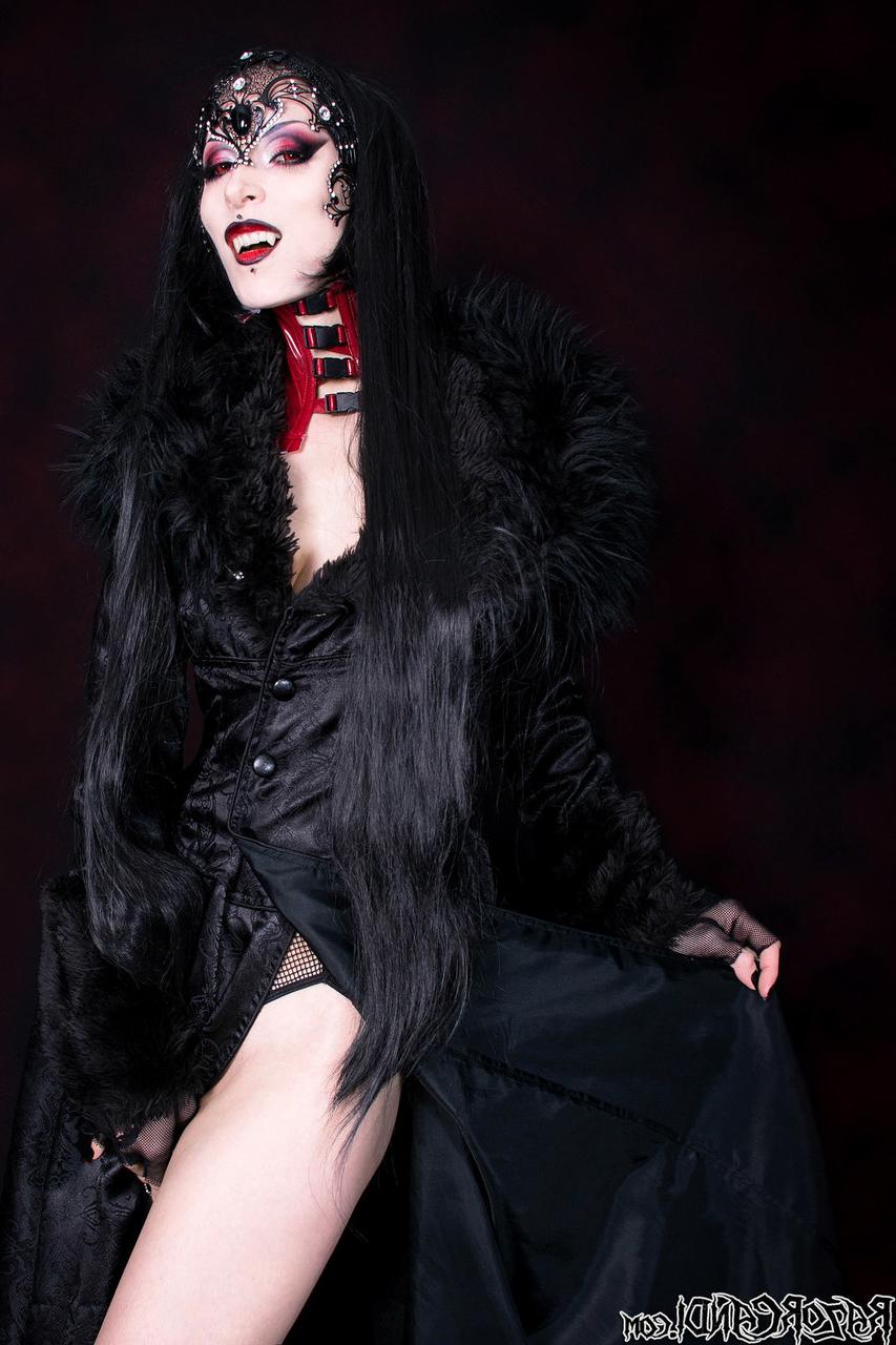 15P Goth girl Razor Candi works her tits and twat clear of see thru onesie