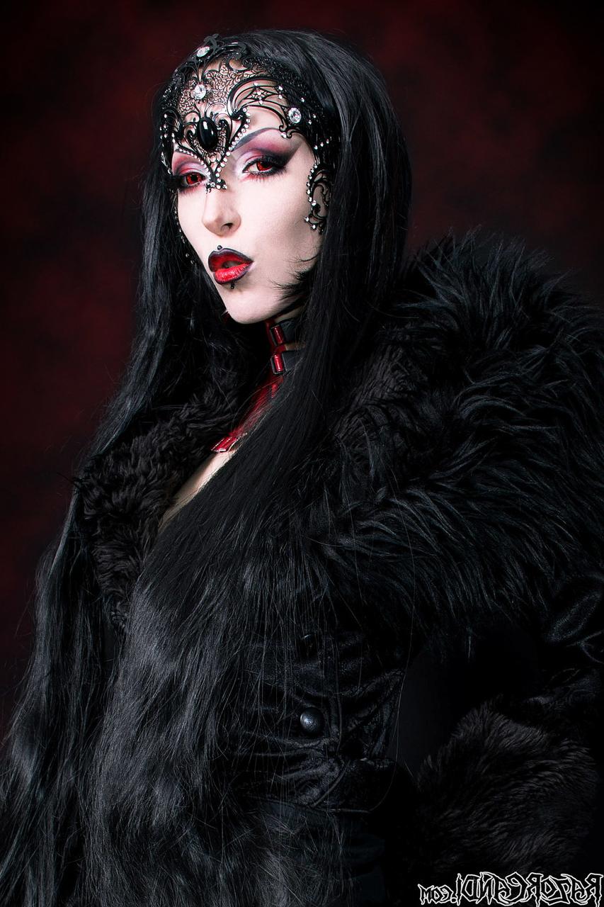 15P Goth girl Razor Candi works her tits and twat clear of see thru onesie