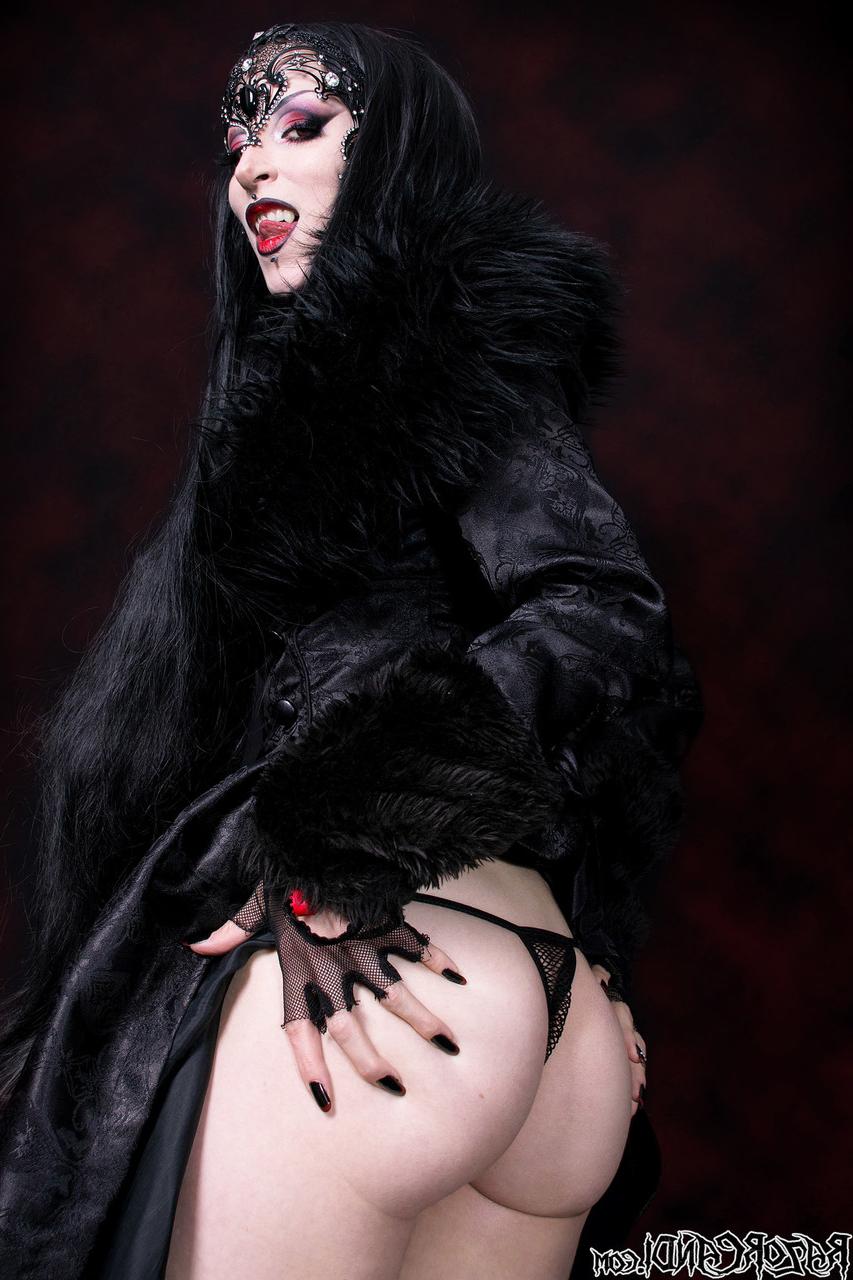 15P Goth girl Razor Candi works her tits and twat clear of see thru onesie