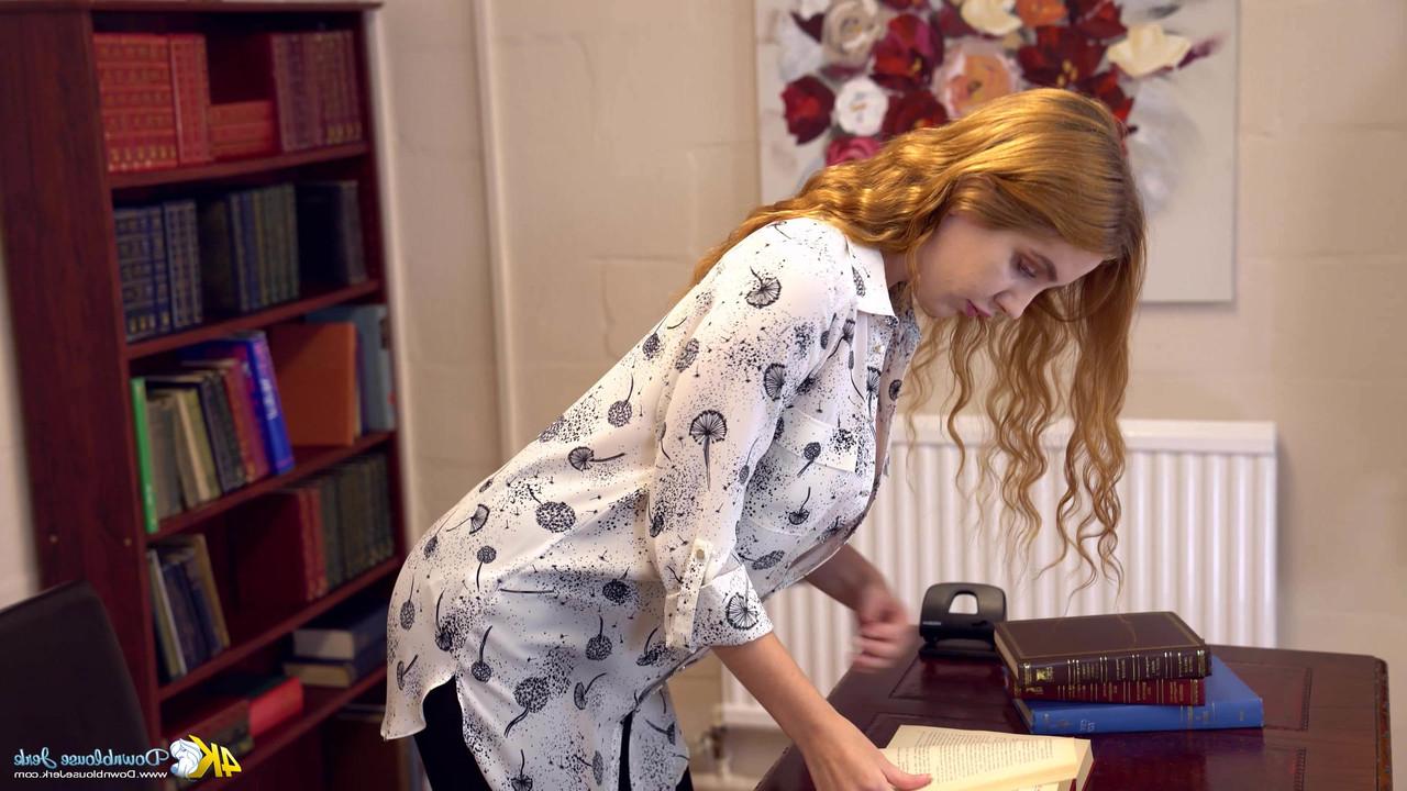 13P Natural redhead shows her inviting cleavage while fully clothed