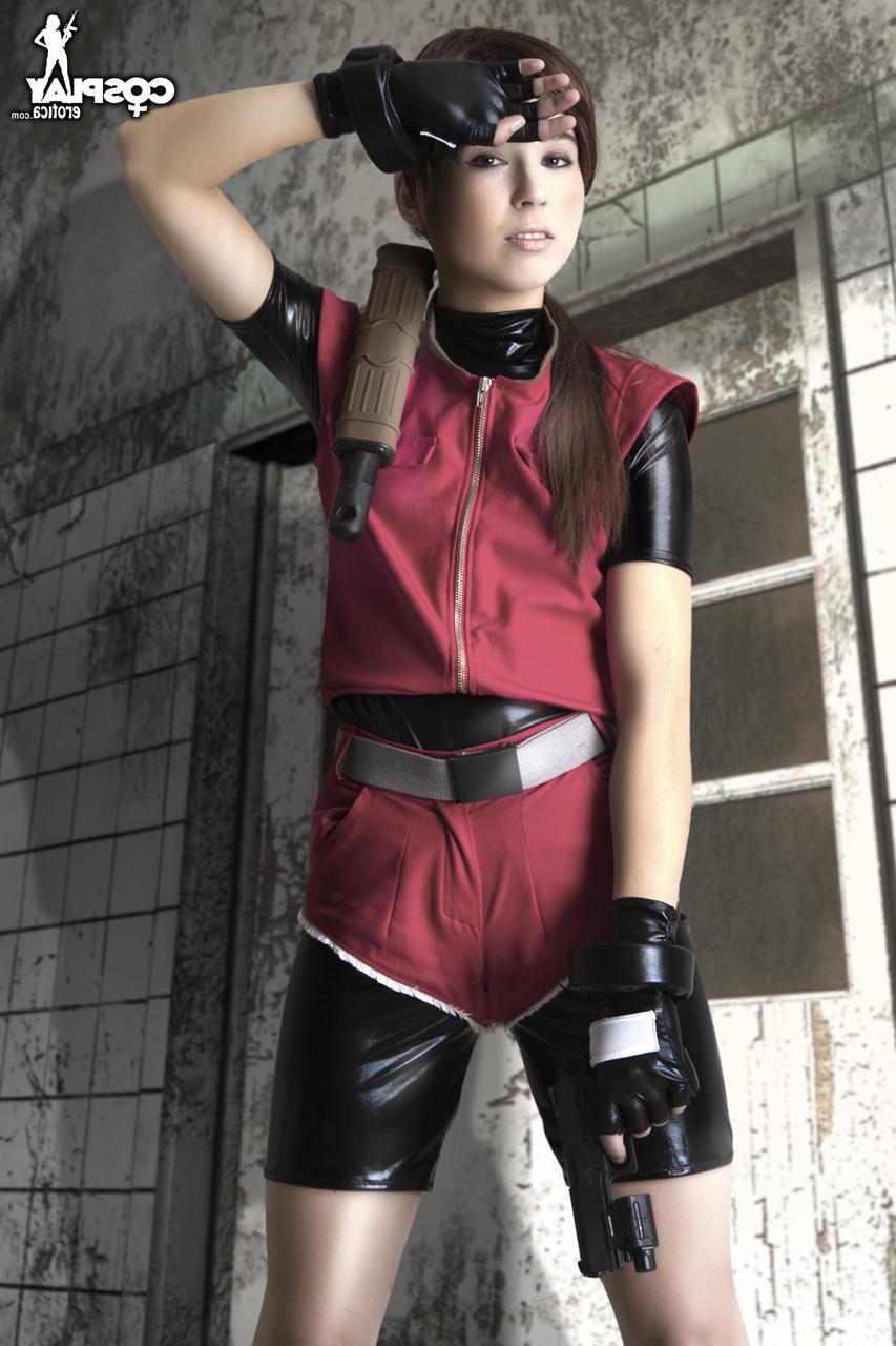 12P Cosplayer holds her bare ass after wielding a pistol in fingerless gloves