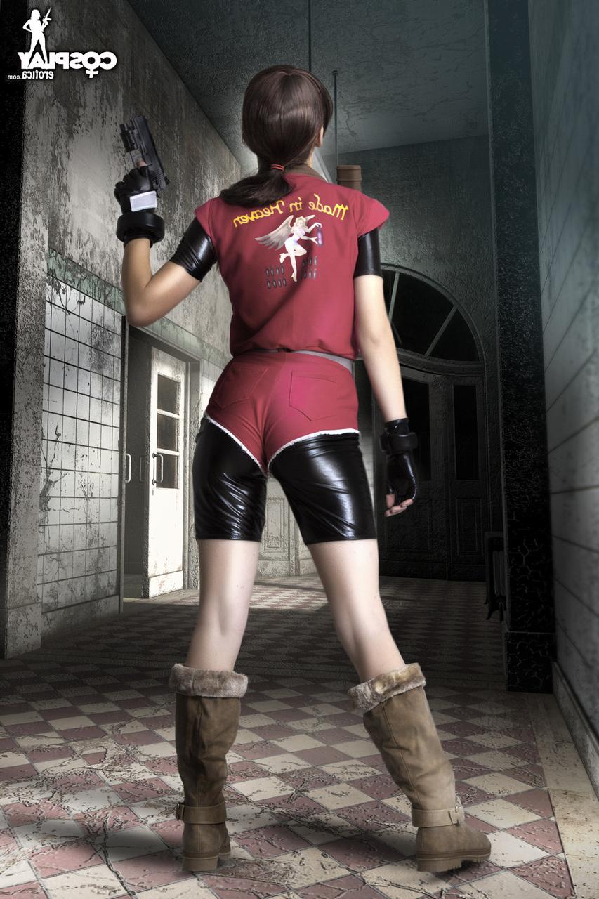 12P Cosplayer holds her bare ass after wielding a pistol in fingerless gloves