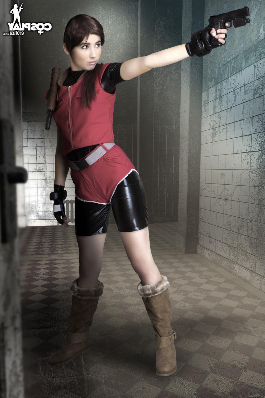 12P Cosplayer holds her bare ass after wielding a pistol in fingerless gloves