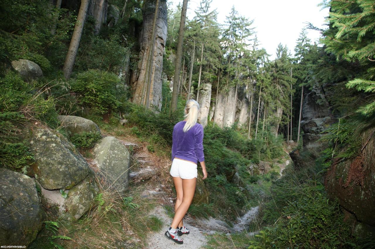 20P Blonde babe with a ponytail Sara J stripping and masturbating in the woods