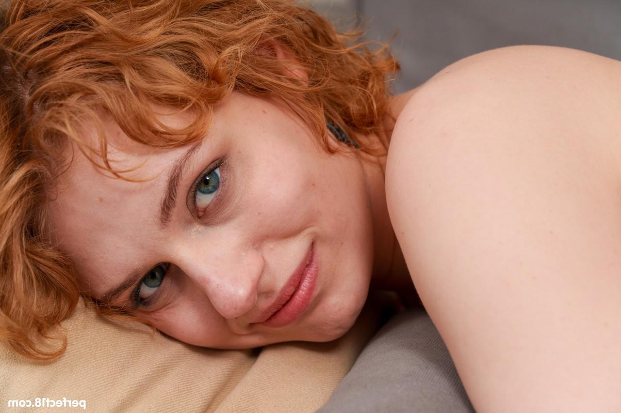 20P Curly-haired ginger Sofi Pure undresses and plays with her trimmed pussy