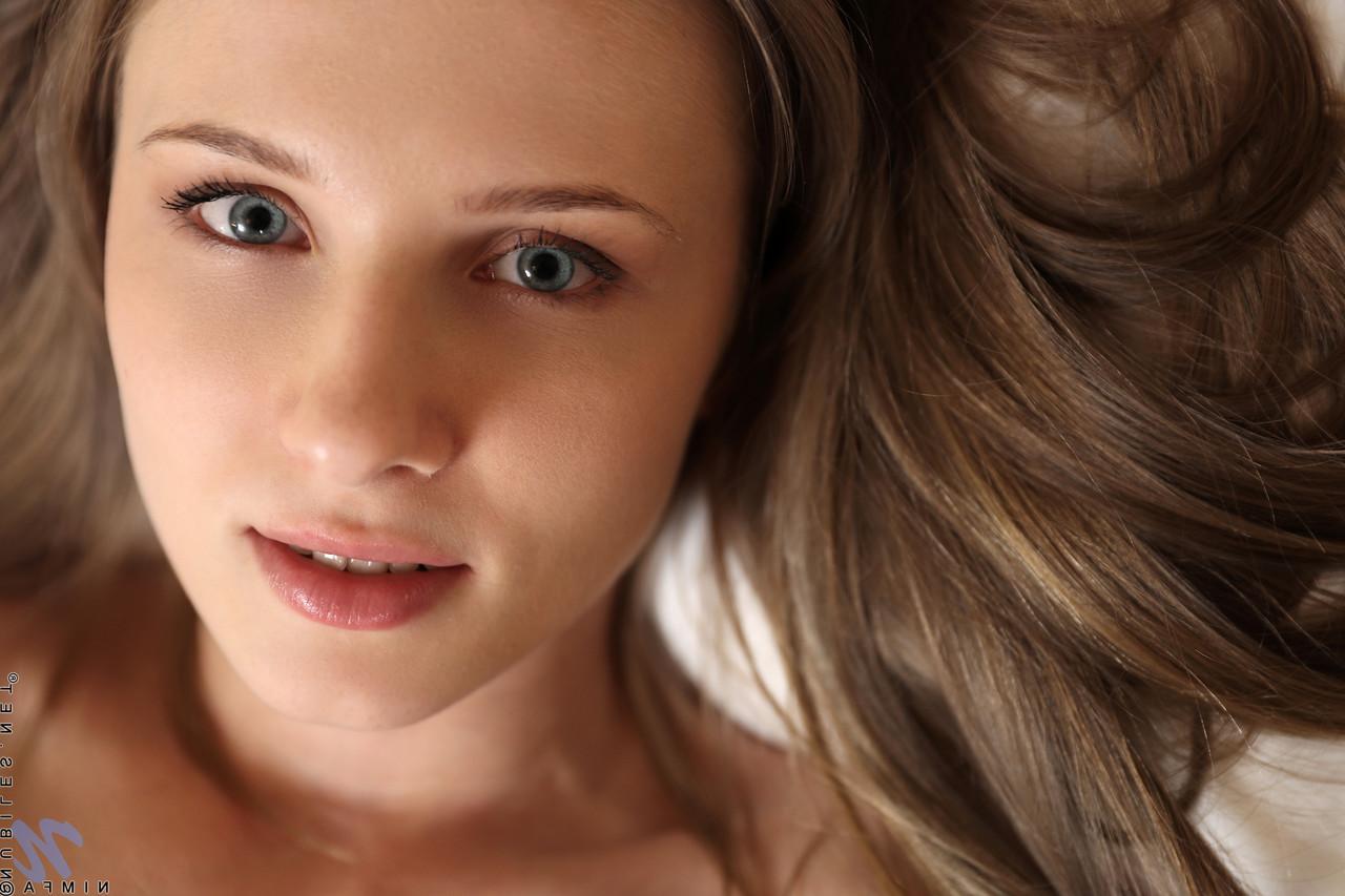 20P Slim teen Nimfa unveils her bald pussy and spreads her love holes on a bed