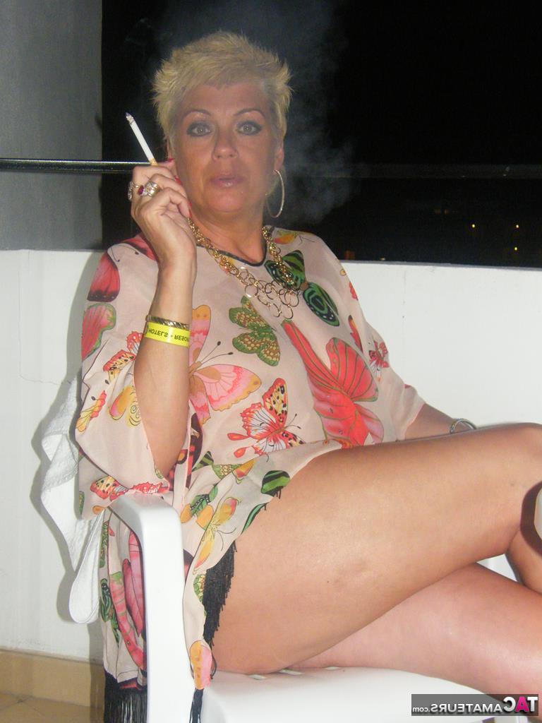 20P Middle-aged blonde Dimonty smokes while getting completely naked