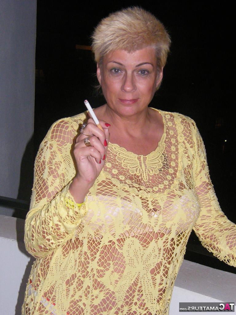20P Middle-aged blonde Dimonty smokes while getting completely naked