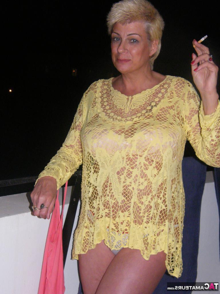 20P Middle-aged blonde Dimonty smokes while getting completely naked