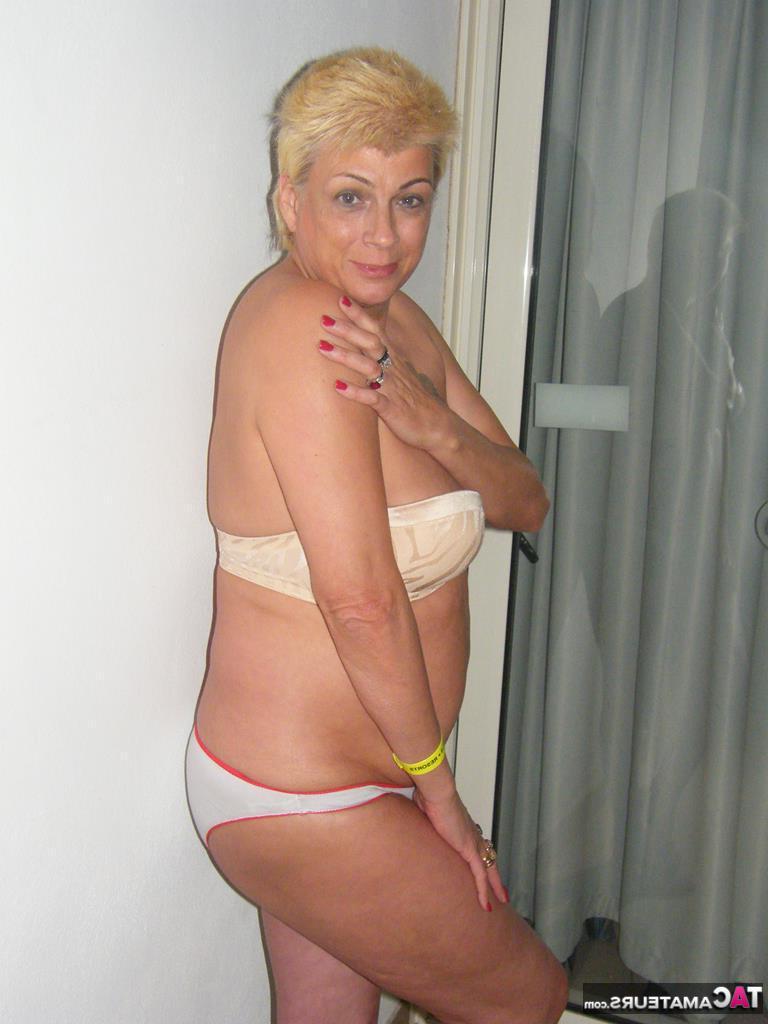 20P Middle-aged blonde Dimonty smokes while getting completely naked