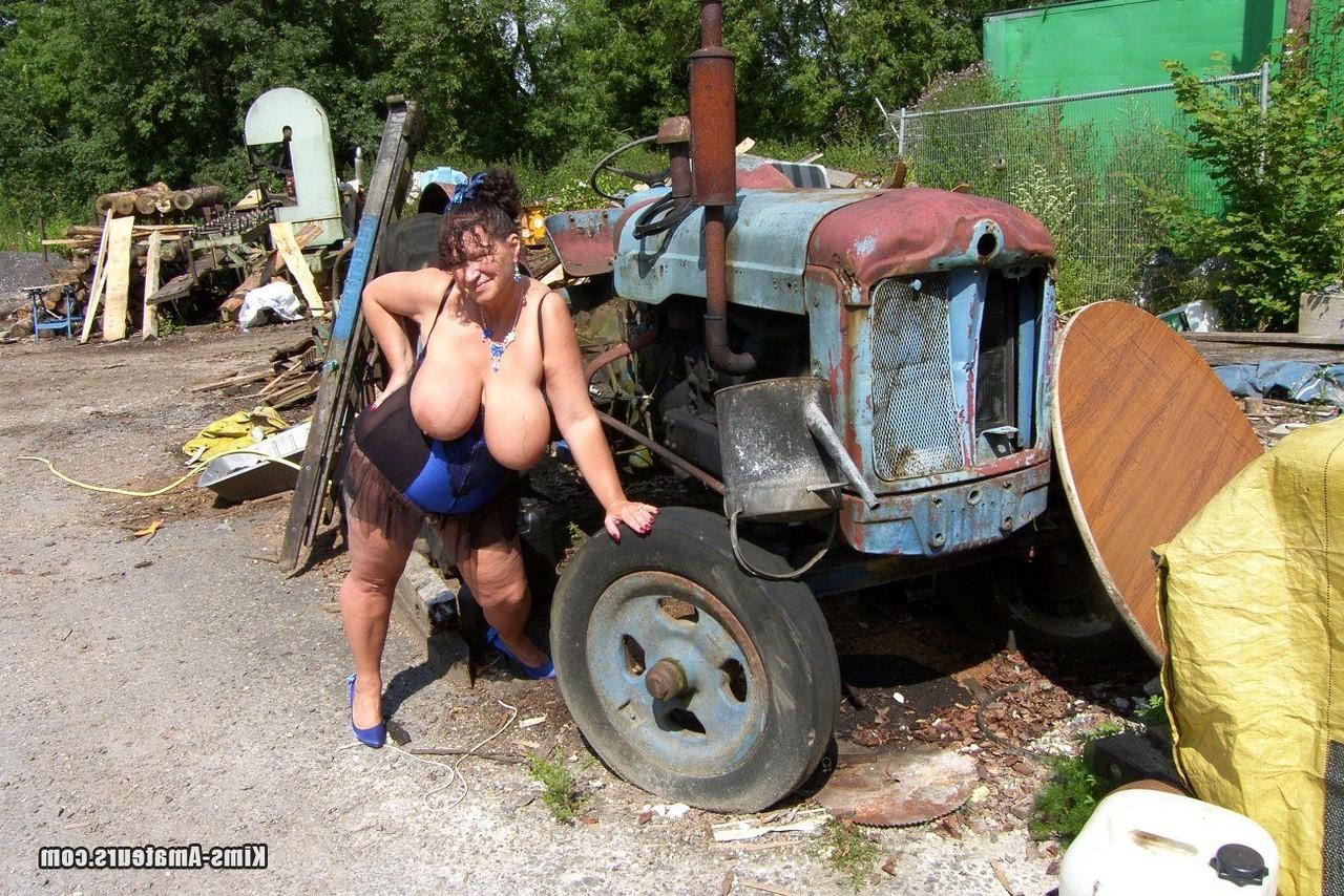 15P Thick older ladies Busty Kim and April have a threesome amid farm equipment