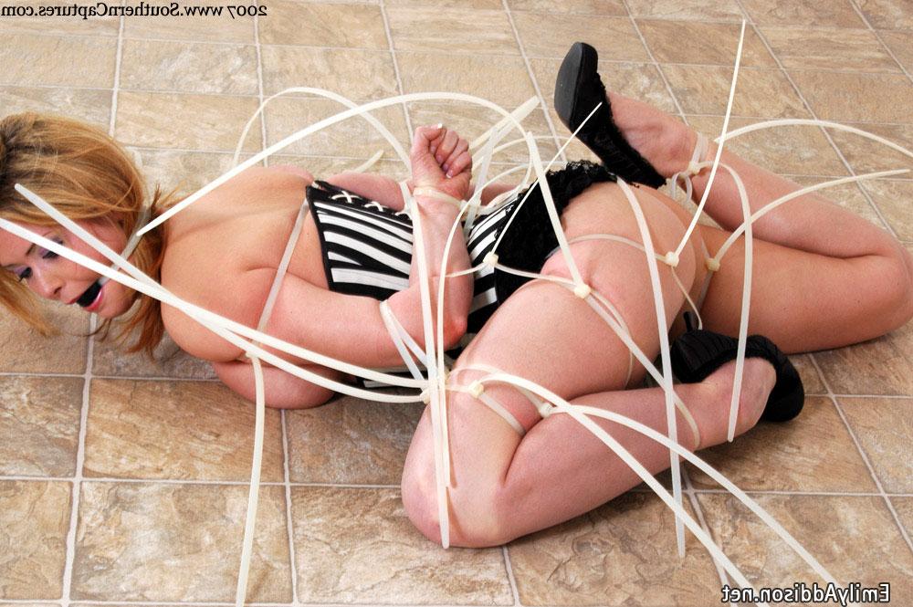 20P Corseted brunette Emily Addison gets tied up and gagged with zip-ties