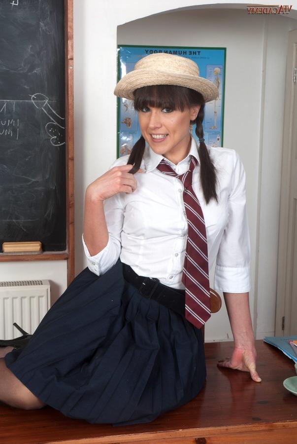 16P Female student pulls down her cotton underwear on a desk in a classroom