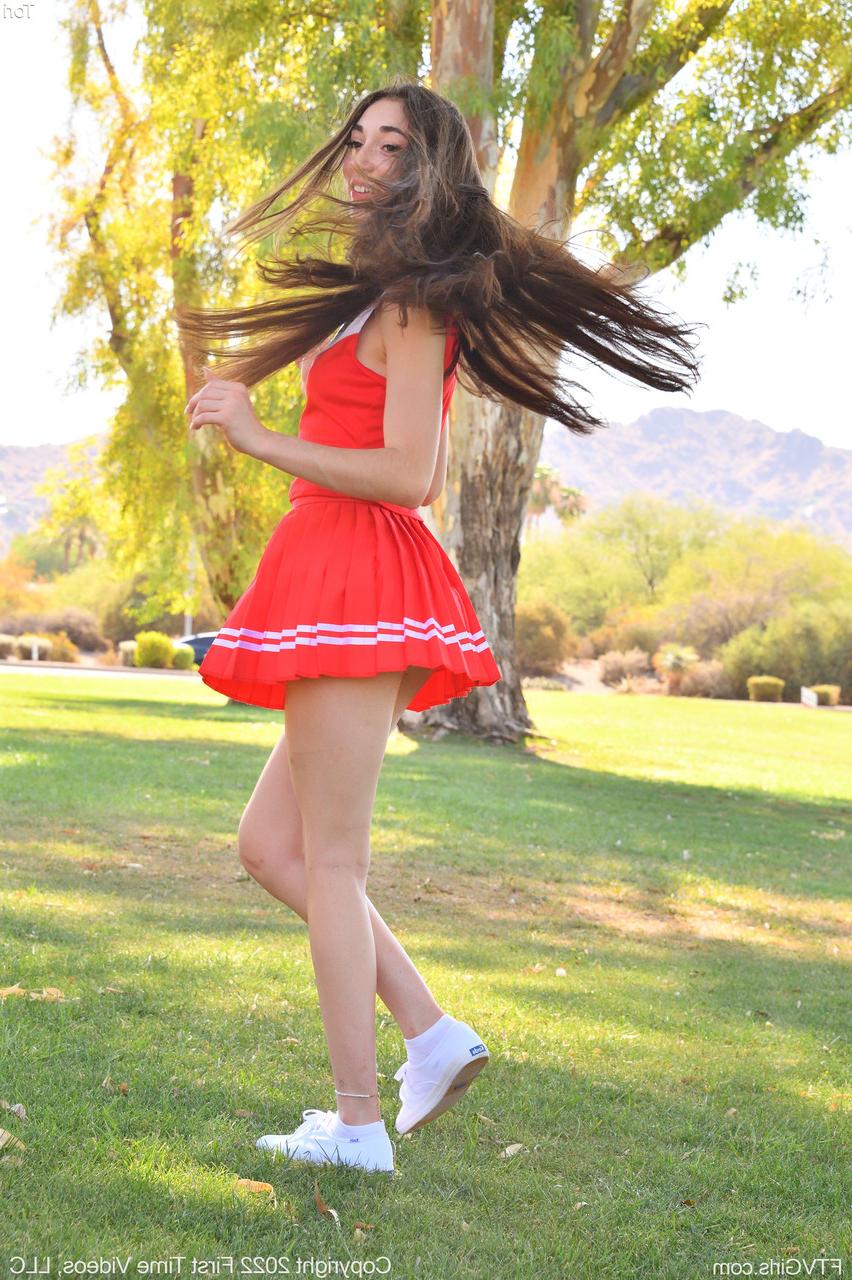 20P Pretty cheerleader Tori flashes her tit & masturbates with a vibrator outdoors