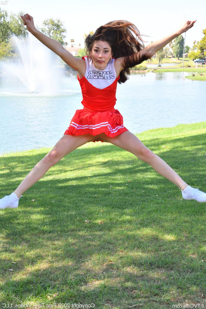 20P Pretty cheerleader Tori flashes her tit & masturbates with a vibrator outdoors