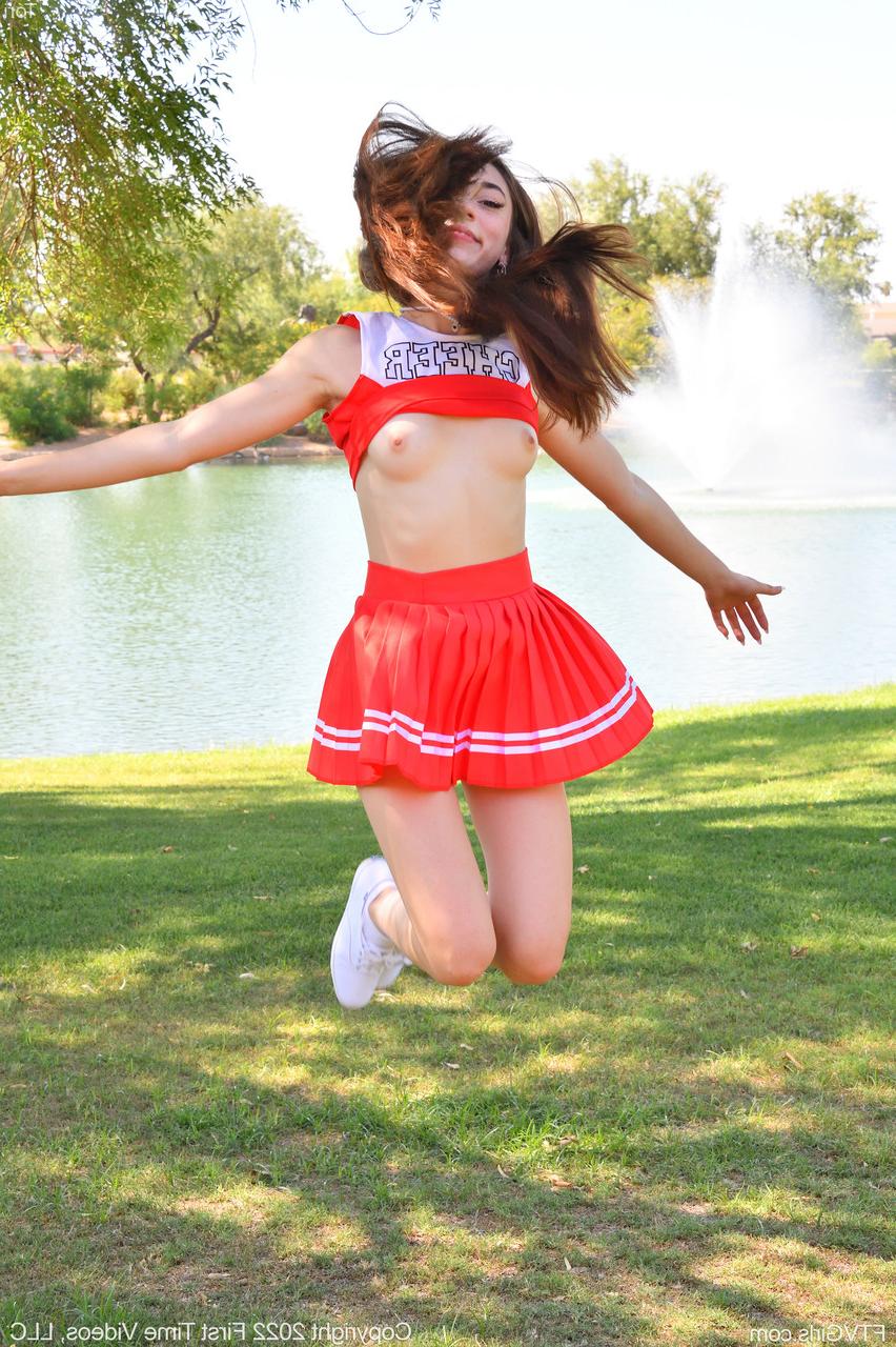20P Pretty cheerleader Tori flashes her tit & masturbates with a vibrator outdoors