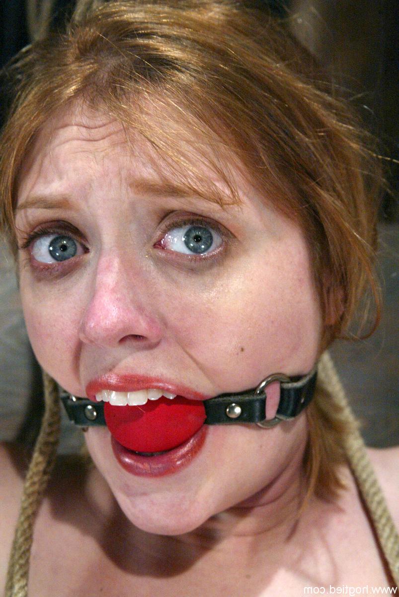 20P Hot submissive babe Dee Williams gets her big boobs tied up on a BDSM table