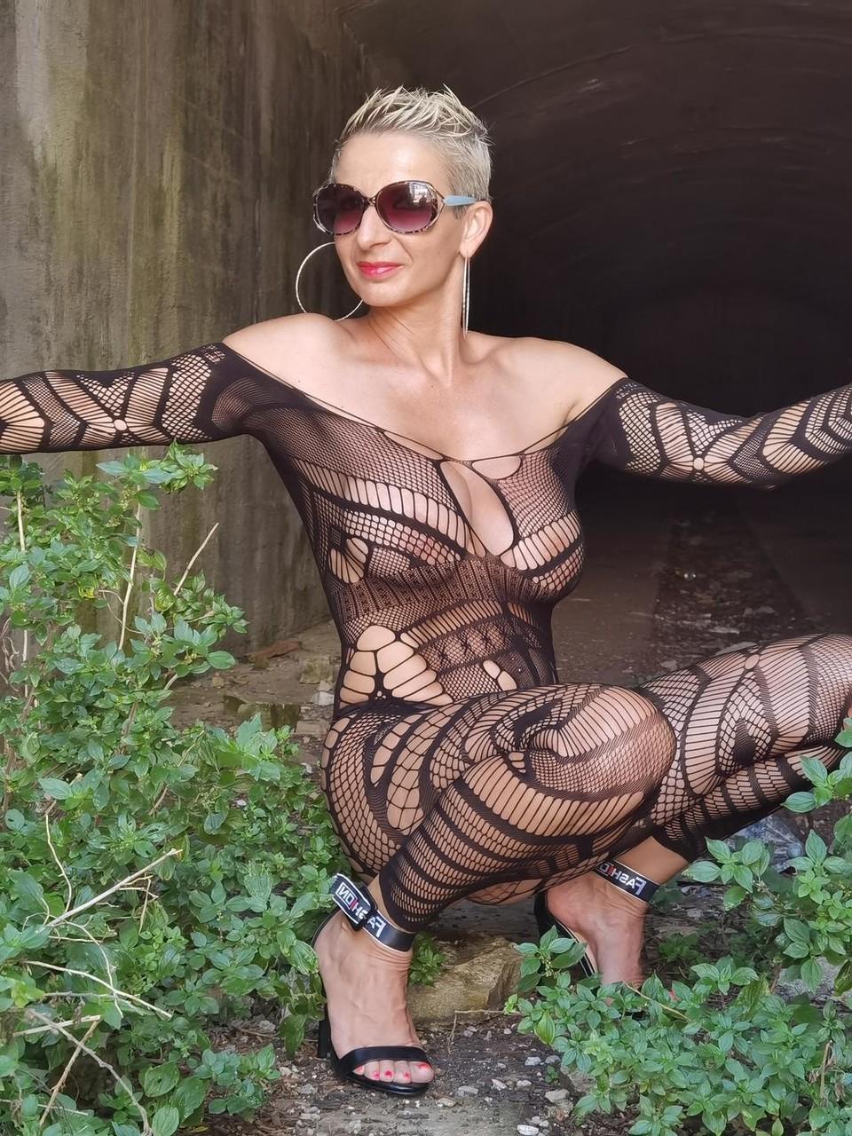 9P Attractive short-haired model flaunts her curves in her see-through lingerie