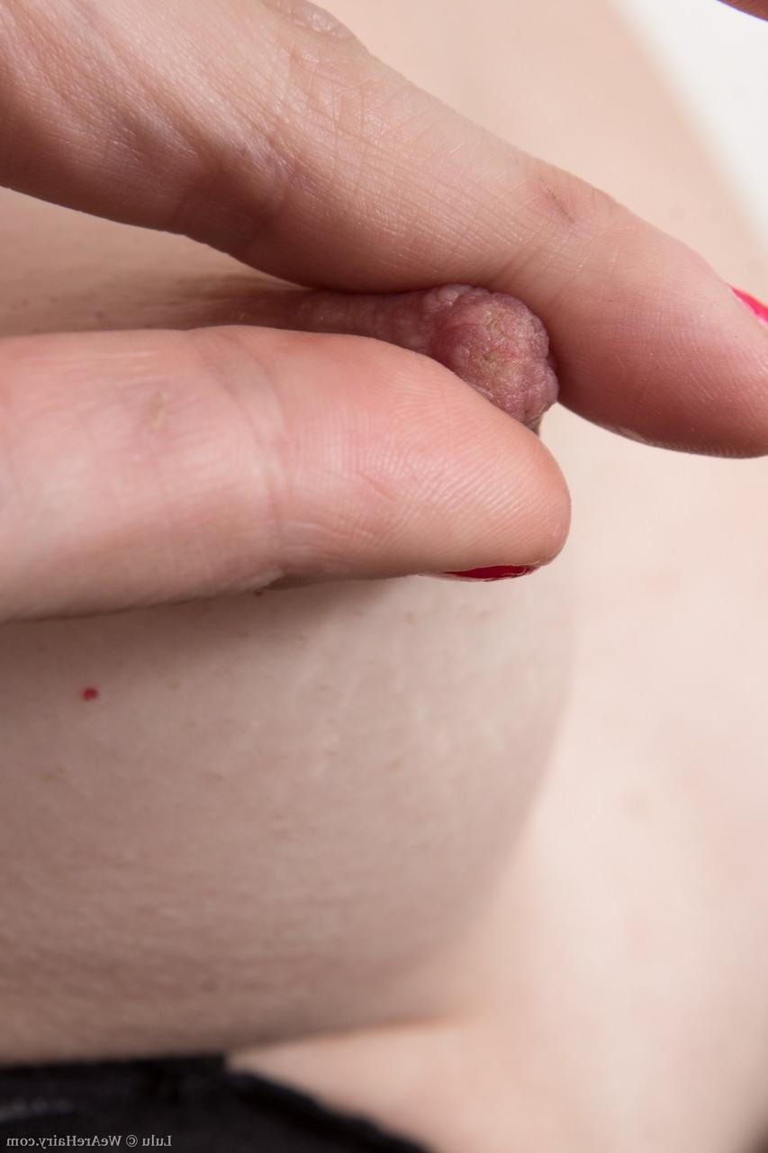 18P Slender female with small breasts and a hairy ass plays with her pubic hair