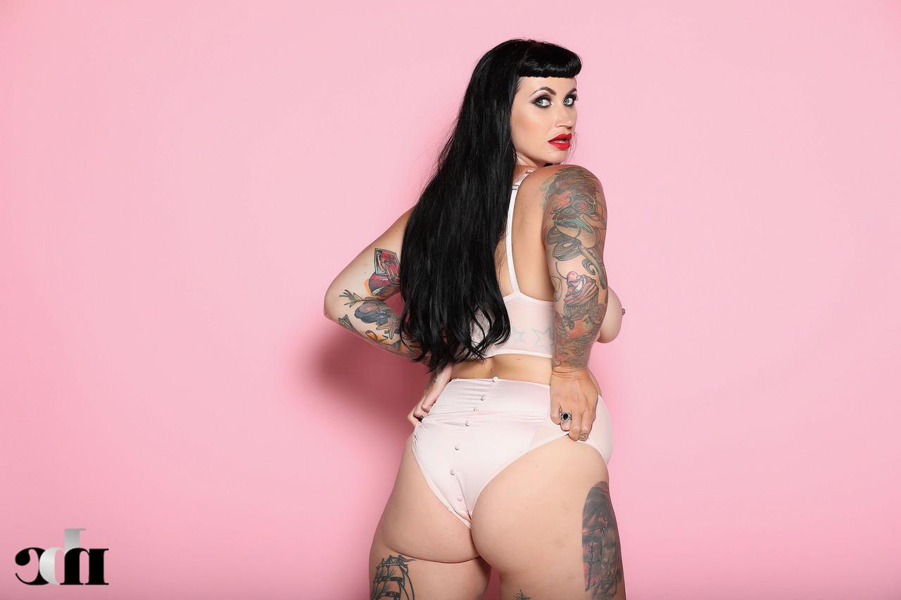 20P Chubby brunette Cherrie Pie reveals her bit tits while showing off her tattoos