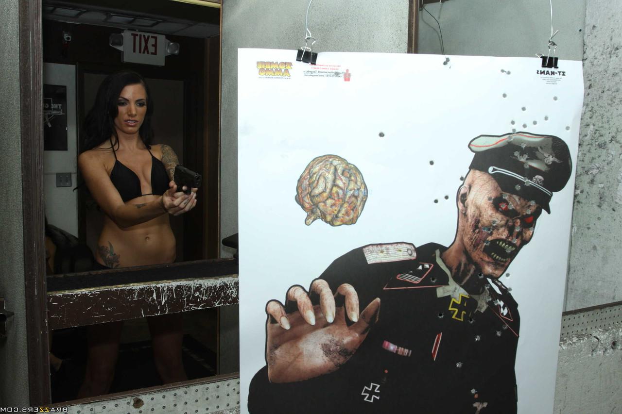 17P Tattooed brunette empties a few rounds at the shooting range in a bikini