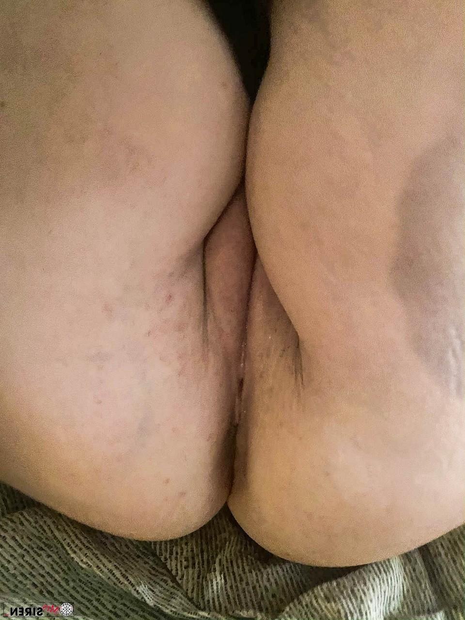 20P Filthy mature with a big ass Dee Siren shows her swollen pussy in a solo