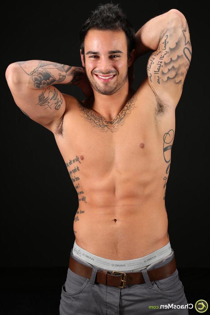 20P Good-looking gay hunk Xavier shows off his tattooed naked body & his hard cock