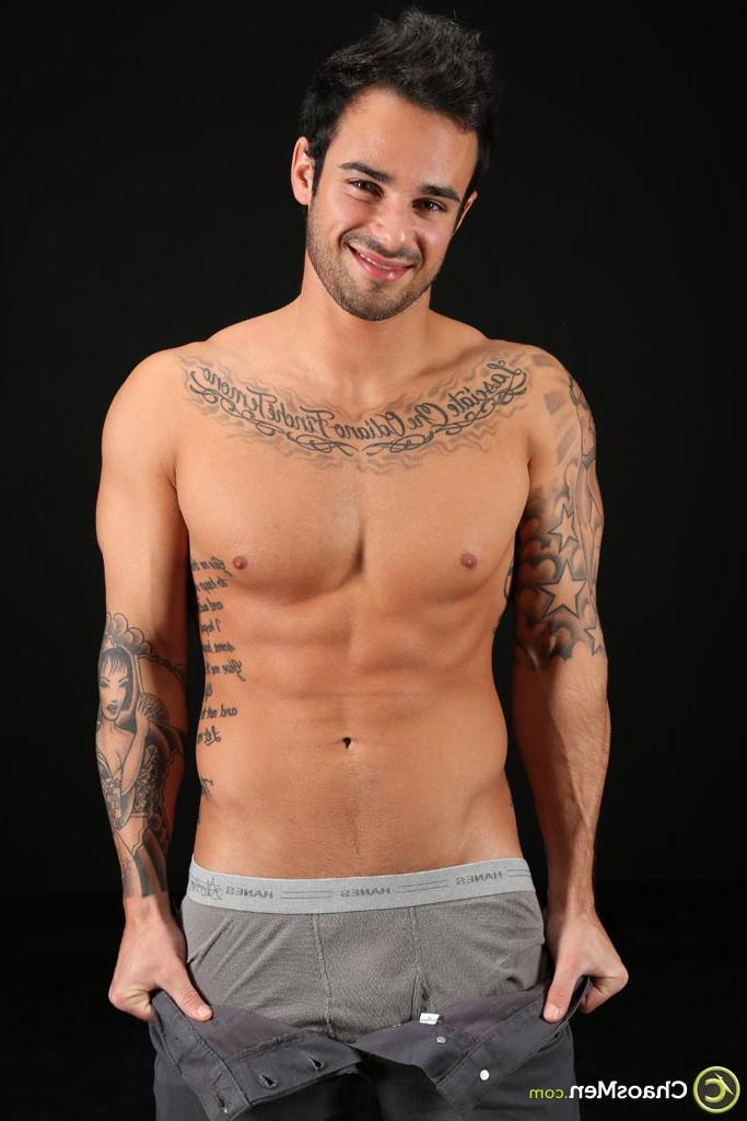 20P Good-looking gay hunk Xavier shows off his tattooed naked body & his hard cock