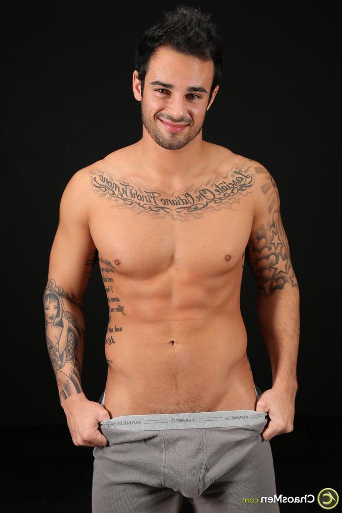 20P Good-looking gay hunk Xavier shows off his tattooed naked body & his hard cock