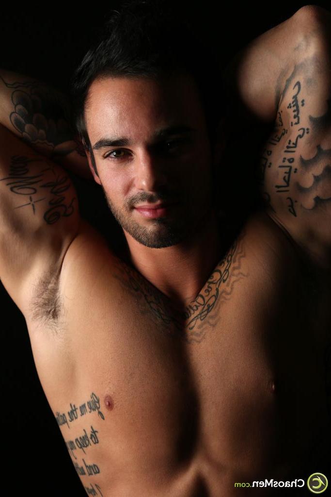 20P Good-looking gay hunk Xavier shows off his tattooed naked body & his hard cock