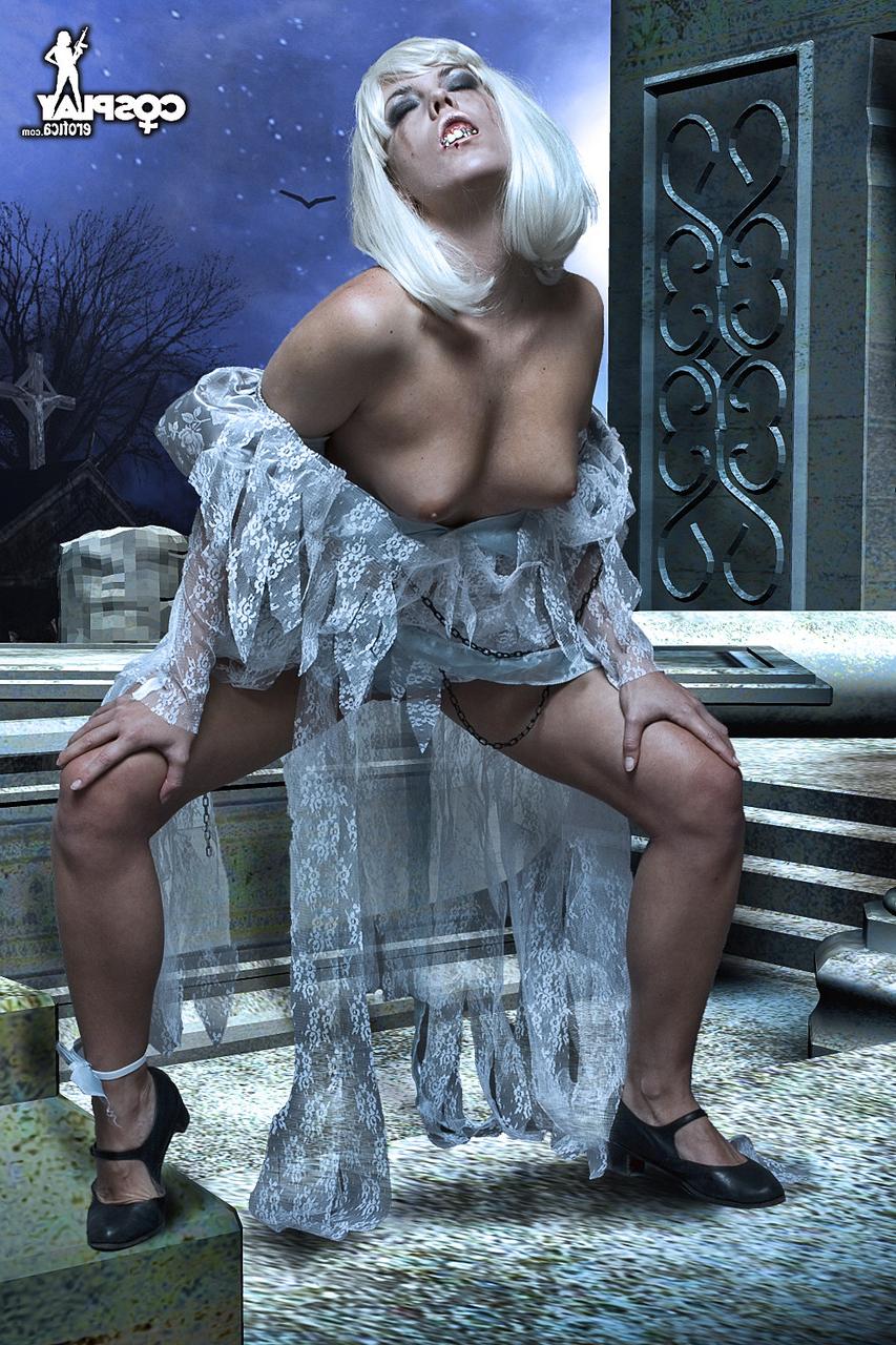 12P Blonde cosplay enthusiast emerges from a casket to show her tits and pussy