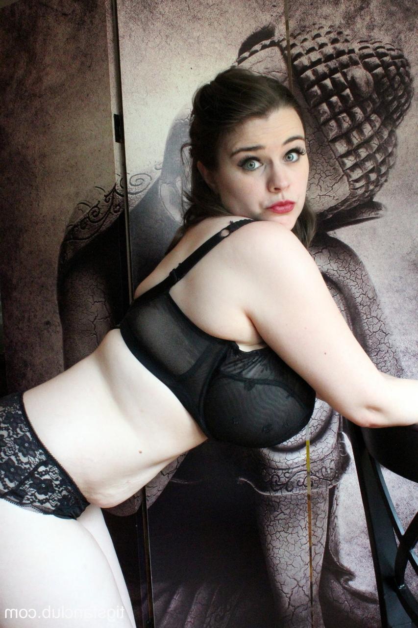 15P Comely brunette Tiggle Bitties teases with her big boobs in black lingerie