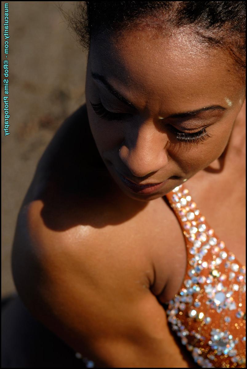 15P Black bodybuilder Stacy Simons flexes during a waterside solo shoot