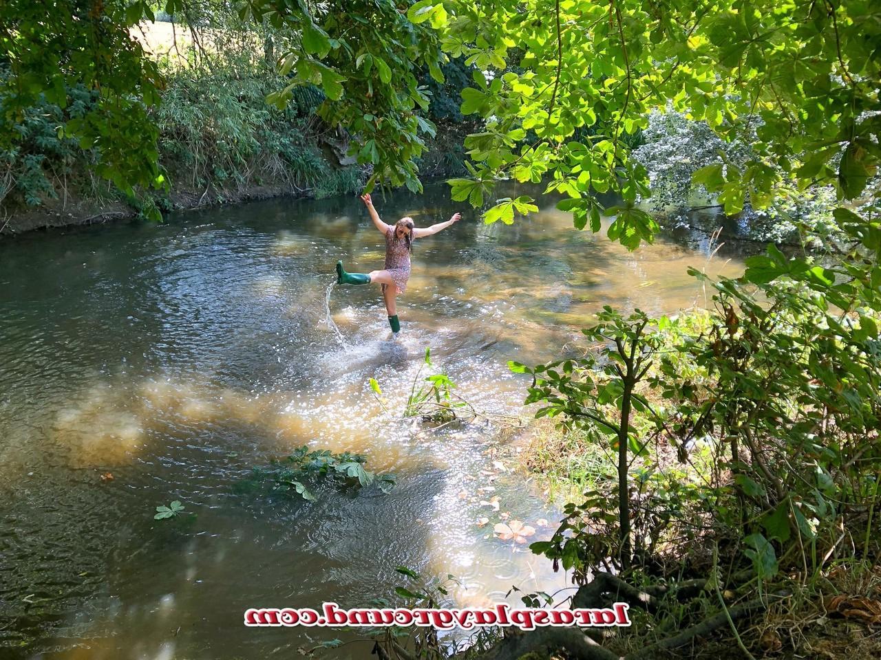 20P Horny British MILF Lara posing pantyless in her rubber boots in the river