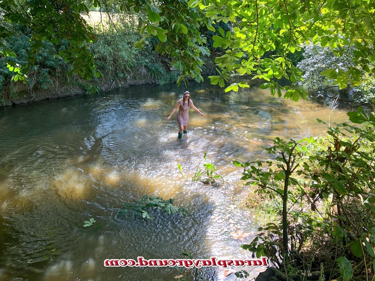 20P Horny British MILF Lara posing pantyless in her rubber boots in the river