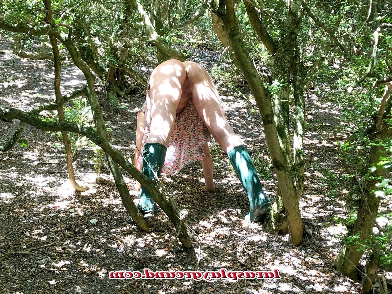 20P Horny British MILF Lara posing pantyless in her rubber boots in the river