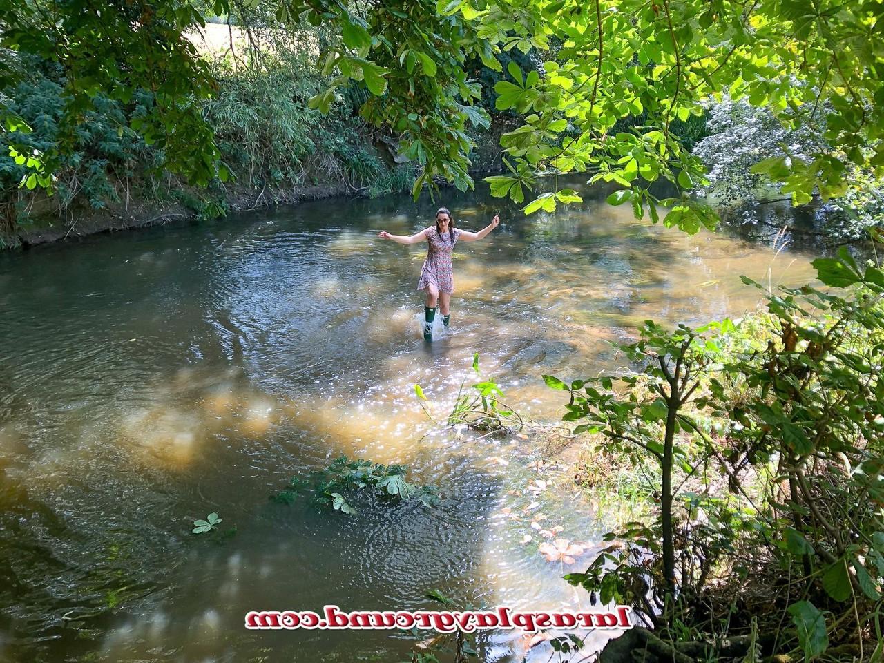 20P Horny British MILF Lara posing pantyless in her rubber boots in the river