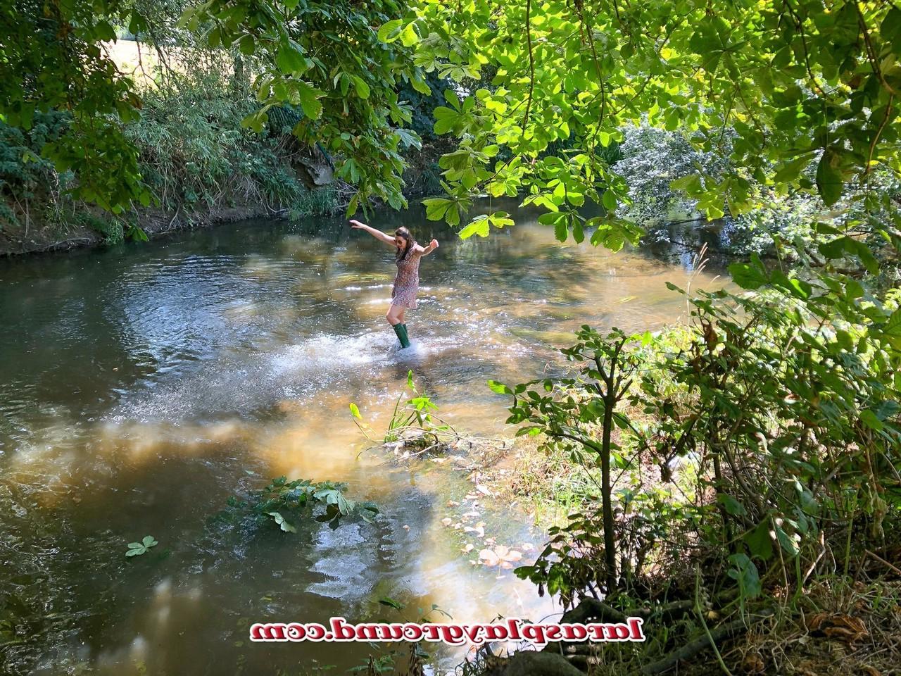20P Horny British MILF Lara posing pantyless in her rubber boots in the river