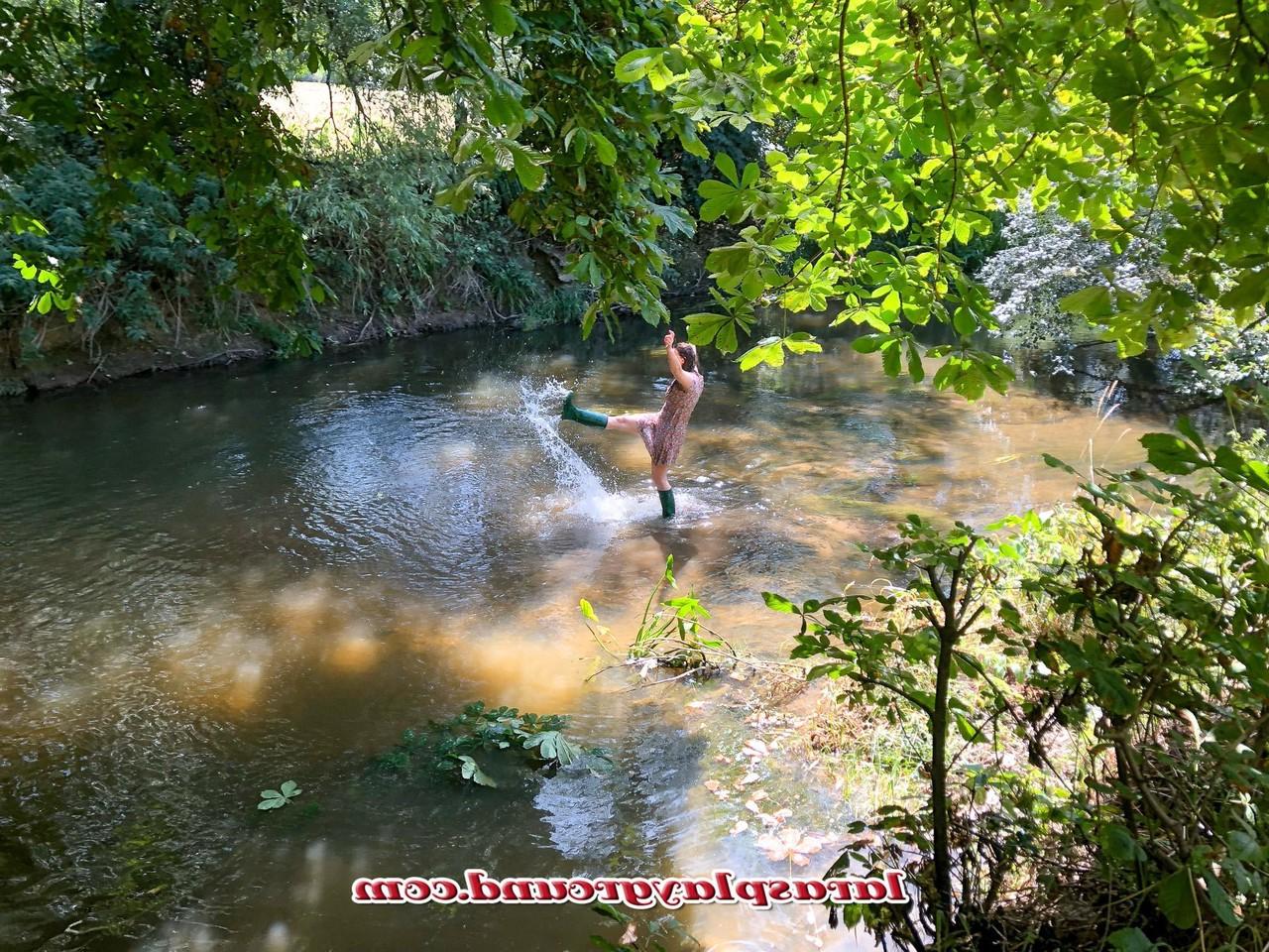 20P Horny British MILF Lara posing pantyless in her rubber boots in the river