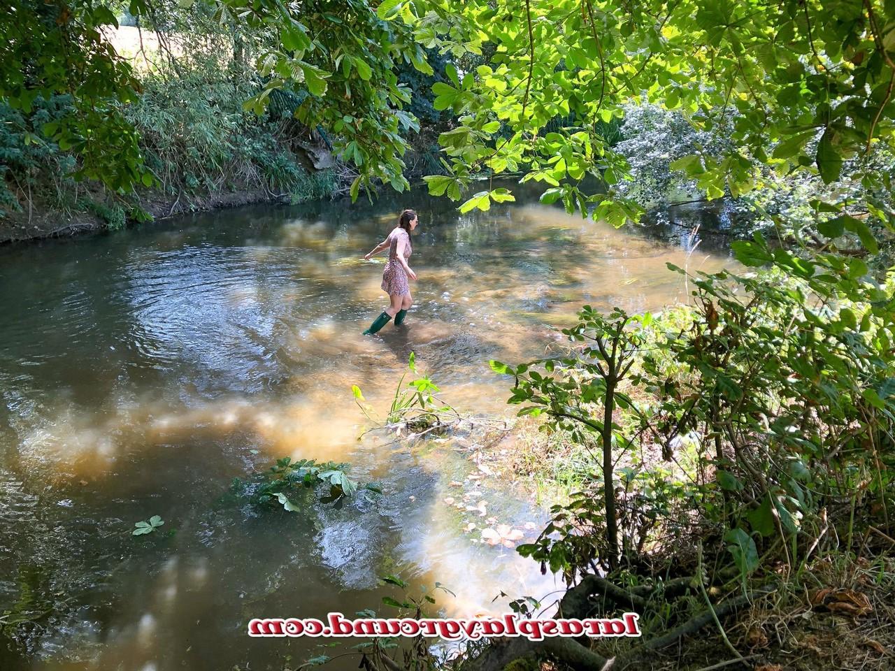 20P Horny British MILF Lara posing pantyless in her rubber boots in the river